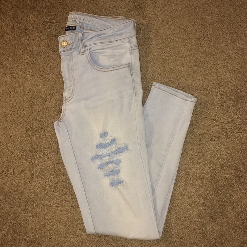 Mid-rise Light wash destroyed AE jeans